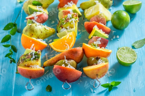 Preview: Colorful Fruit Skewers on a Bright Blue Table
