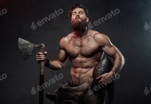 Preview: Medieval viking with axe and helmet in dark background
