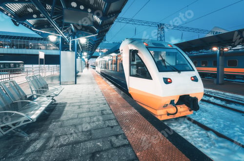 Preview: High speed train on the railway station at night