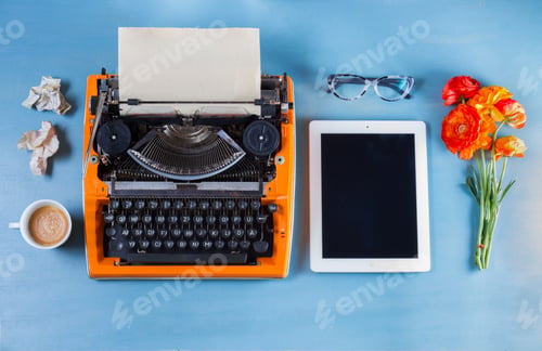 Preview: Workspace with vintage orange typewriter