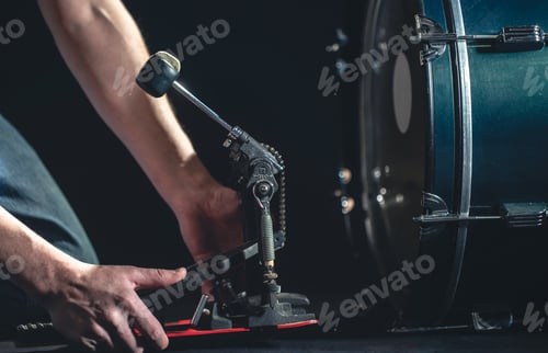 Preview: Bass drum and drummer, musical instrument on black background.