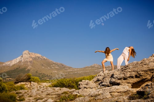Preview: Young women posing on stones