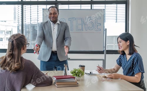 Preview: Business People Meeting using laptop computer,calculator,notebook,stock market chart paper for