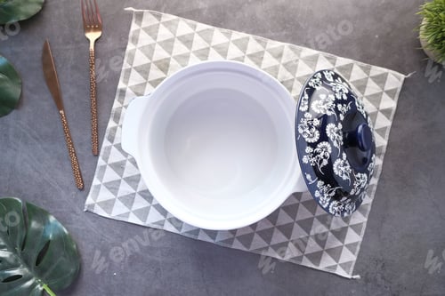 Preview: cutlery and empty bowl on black background top down