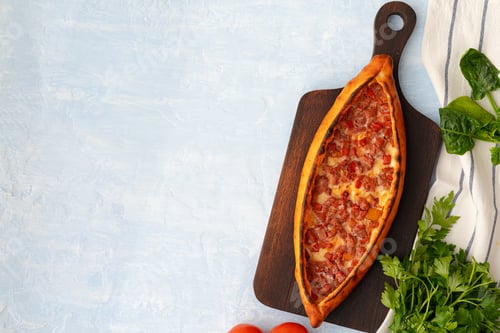 Preview: Turkish baked Pide bread on light blue wooden surface