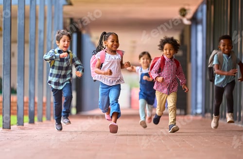 Preview: Group Of Multi-Cultural Elementary School Pupils Running Along Walkway Outdoors At School
