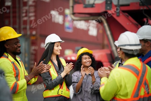 Preview: Team members celebrate successful completion of project at shipping yard