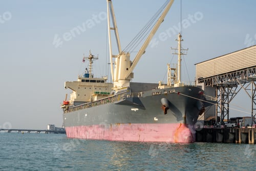 Preview: Big crane loading cargo container from truck to container ship in the international