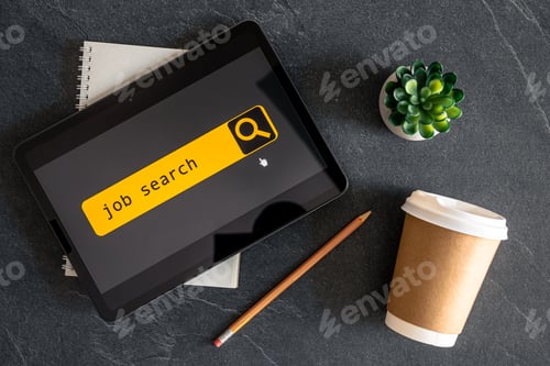 Preview: Top view of digital tablet with search job on screen.