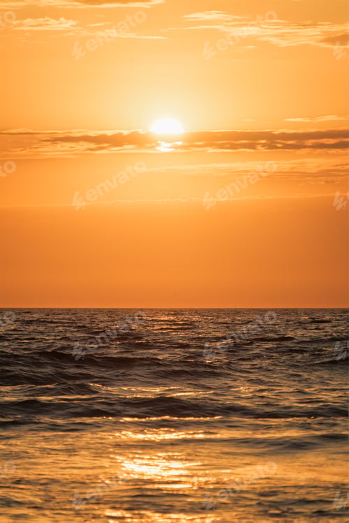 Preview: Ocean waves on sunset background