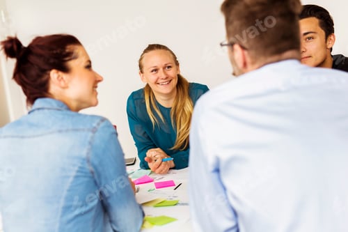 Preview: Colleagues talking during business meeting
