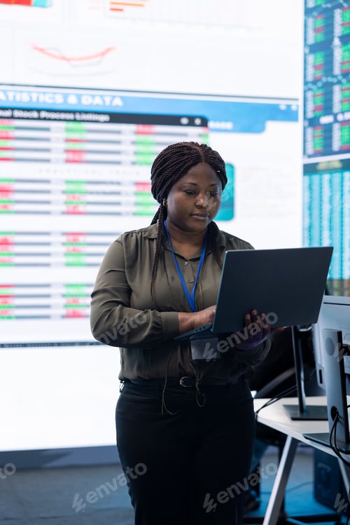 Preview: Chief financial officer studying capital funds and revenue data on big screen