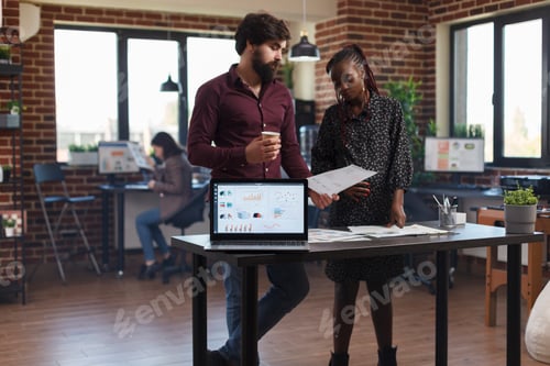 Preview: Financial agency coworkers brainstorming project ideas with laptop showing charts on display.