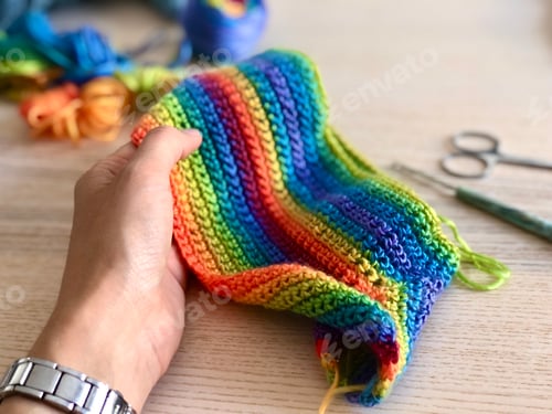 Preview: Woman crocheting of rainbow yarn, lgbtq friendly, pride month, diversity and inclusivity, equality