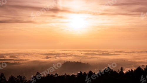Preview: Panorama of Graz city in Styria on autumn morning during sunraise above fog