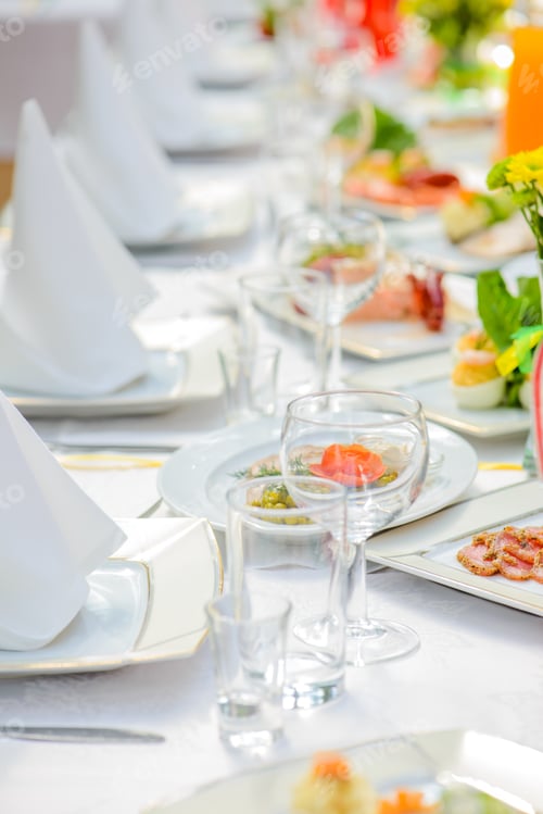 Elegant Table Setting with Food and Drink