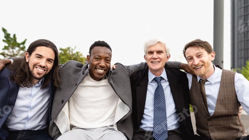 Preview: Team of multiracial business people with different ages standing in the city during meeting work