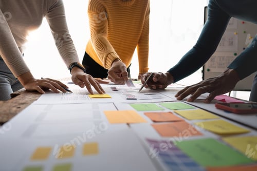Preview: Close up ux developer and ui designer brainstorming about mobile app interface wireframe design on
