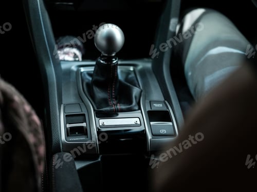 Preview: Closeup of a black modern manual car transmission gear shifter