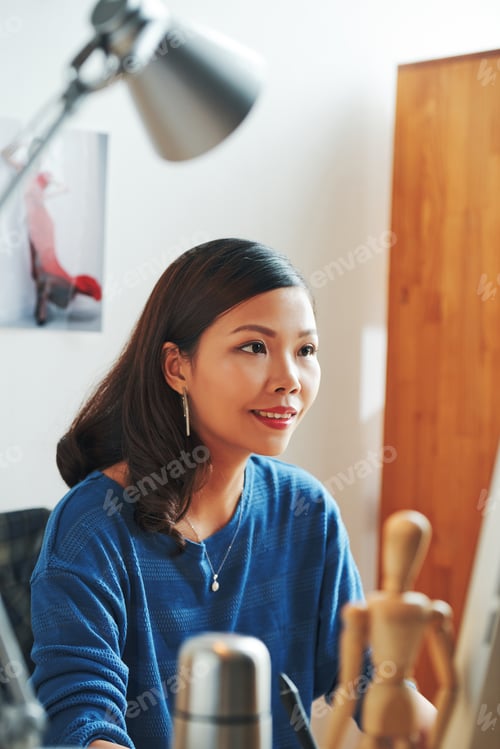 Preview: Smiling Woman Working On Graphic Design