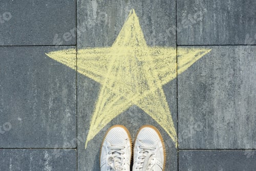 Preview: Drawing of crayons on the asphalt - star and feet