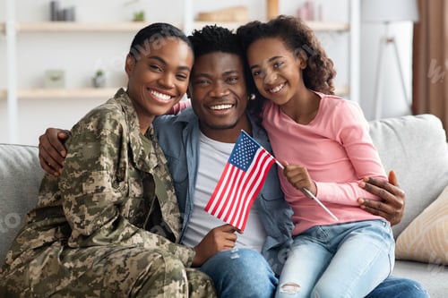 Preview: Beautiful black family celebrating reunion at home