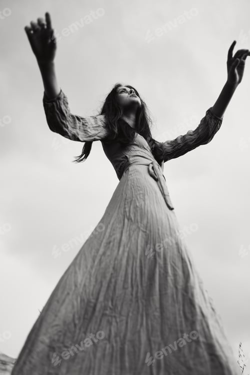 Preview: portrait of a beautiful woman in dress gesturing with hands posing elegant style