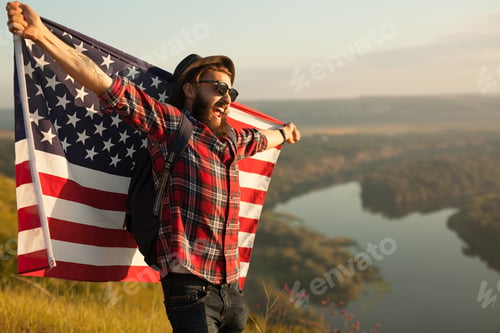 Preview: Happy traveler with flag on nature