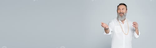 Preview: smiling spiritual mentor looking away and pointing with hand isolated on grey, banner
