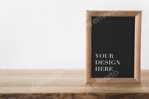 Preview: blackboard in frame with text your design here on white