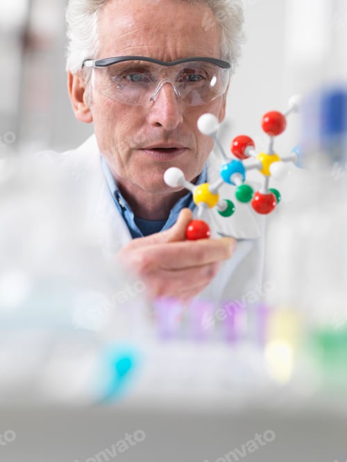Preview: Scientist viewing molecular model of a chemical formula in a laboratory