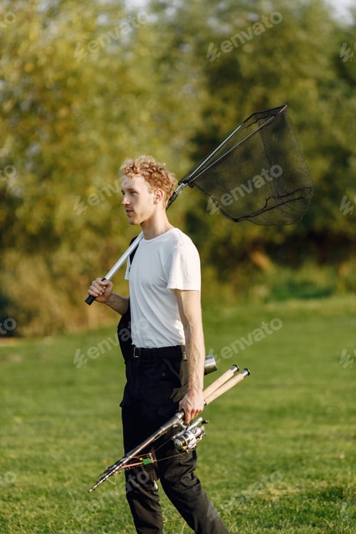 Preview: Portrait of a young man with fishing equipment