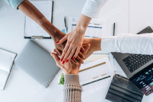 Preview: Teamwork, hands on hands, successful. Top view of hands of business people