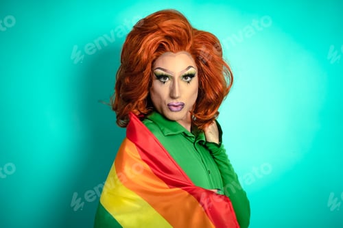 Preview: Happy drag queen celebrating gay pride holding rainbow flag - LGBTQ social community concept