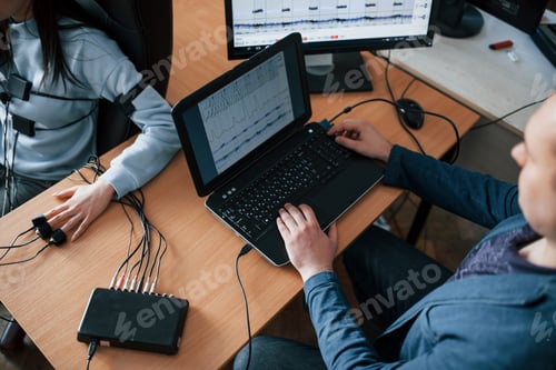 Preview: Girl passes lie detector in the office. Asking questions. Polygraph test