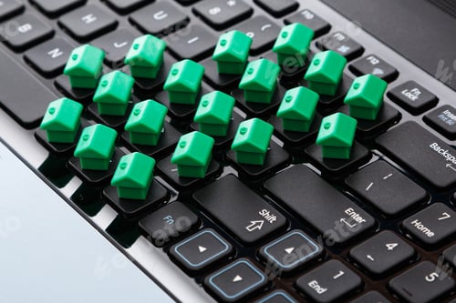 Preview: Small toy houses over keyboard
