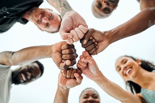 Preview: Shot of a group of friends fist bumping one another before a workout