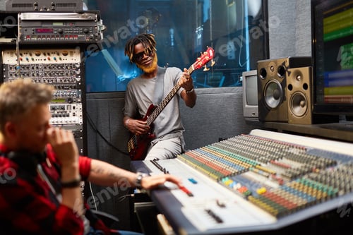 Preview: Musicians Recording in Sound Studio with Mixing Console