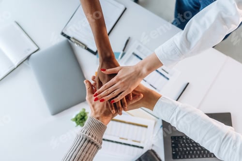Preview: Teamwork, hands on hands, successful. Top view of hands of business people