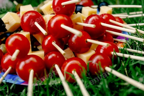 Preview: cherry tomatoes olives cheese on wooden stick appetizer