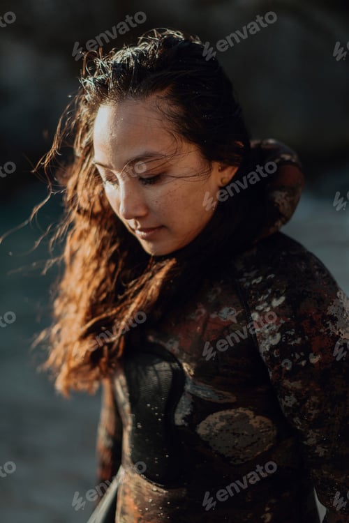 Preview: Woman enjoying breeze on beach