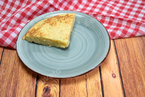 Preview: Tasty cake with egg yolk on a wooden table
