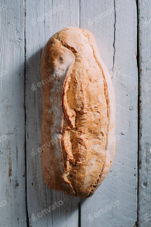 Preview: Rustic bread loaf on dark background