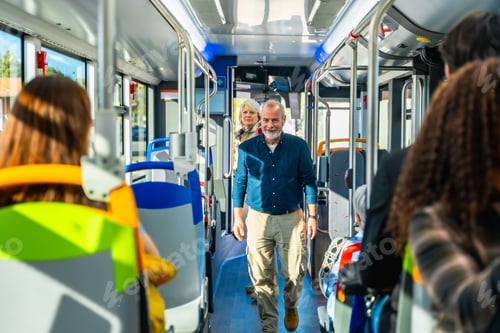 Preview: Senior man smiling travelling on public bus