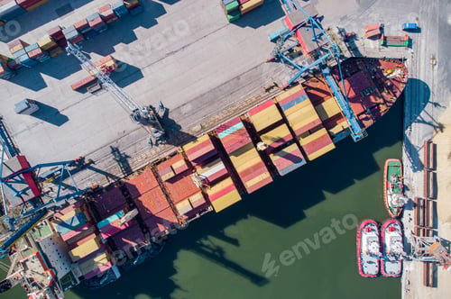 Preview: Aerial view of a container ship being loaded and unloaded at container terminal freight port