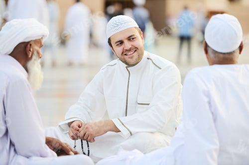 Preview: Small Group Of Middle Eastern Friends Sitting And Talking Outdoors