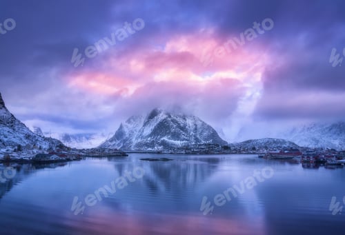 Preview: Aerial view of snowy mountain, village on sea coast, purple sky