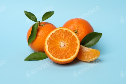 Preview: Ripe sweet mandarins on blue background, close up