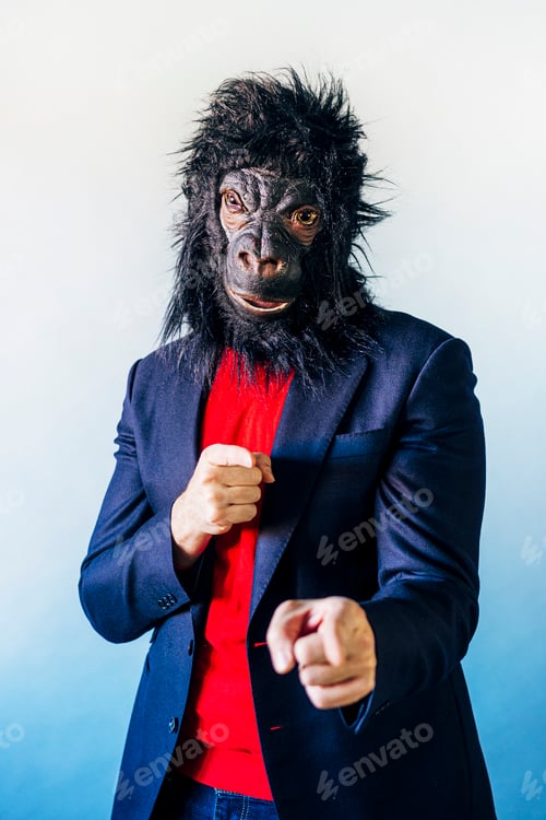 Preview: Man in a suit and with a gorilla mask.
