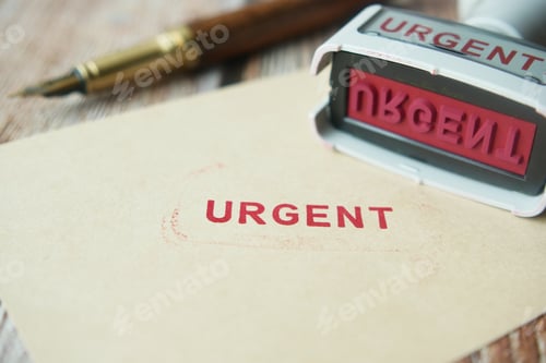 Preview: Red URGENT word stamp on a white paper